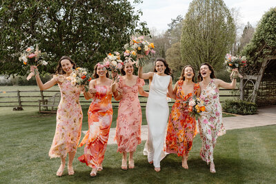 Wedding group photos with beautiful floral arrangements at Hyde House venue